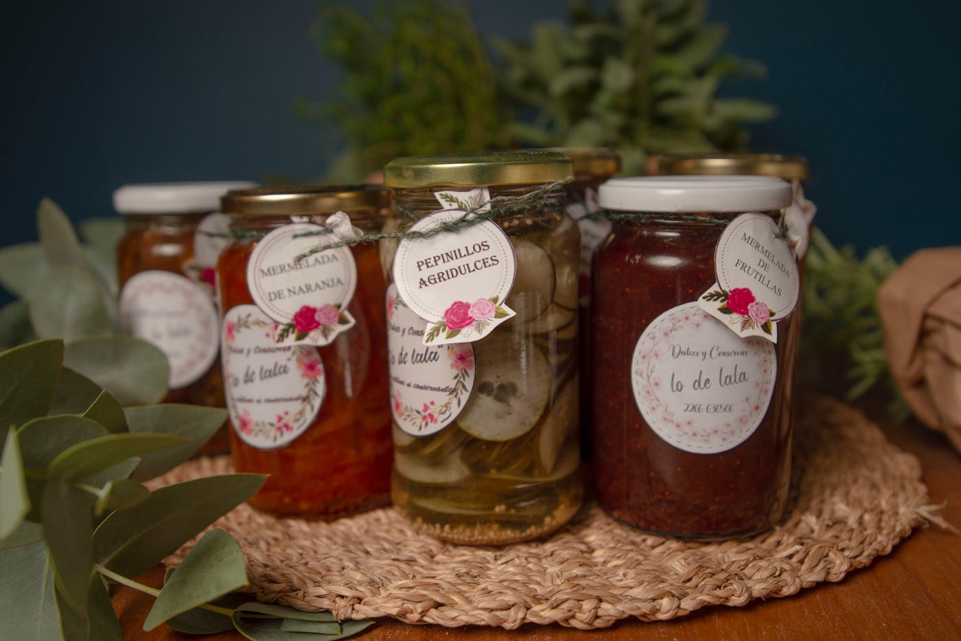 Labeled jars from the Cape Cod Sampler grouped on a woven mat